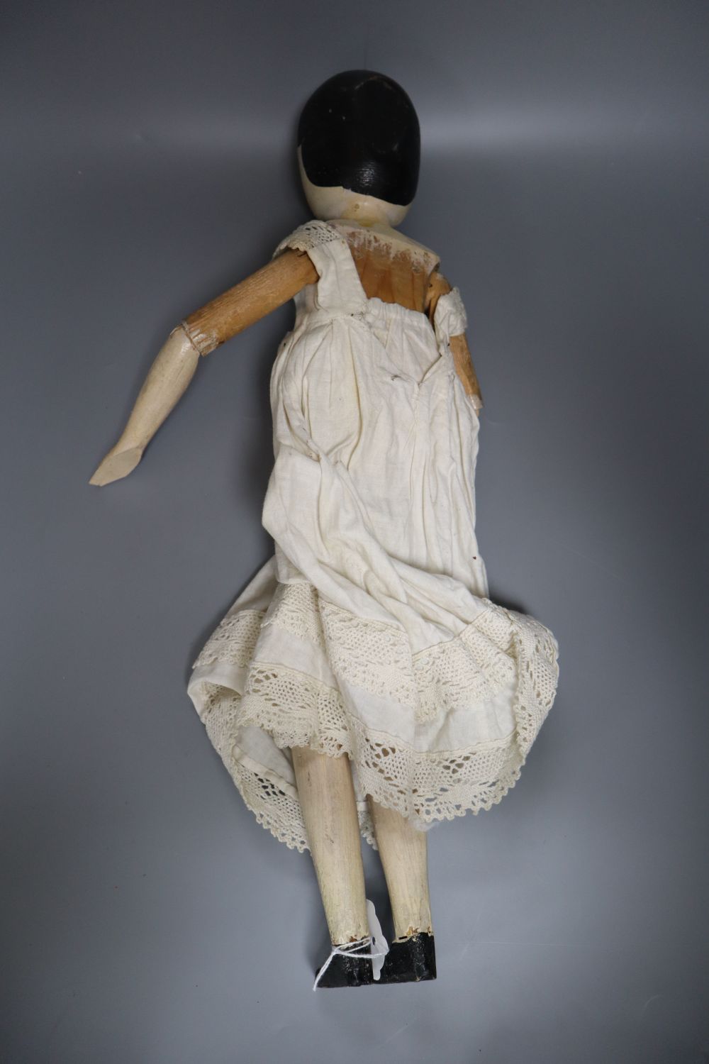 A Victorian painted peg doll, height 53cm